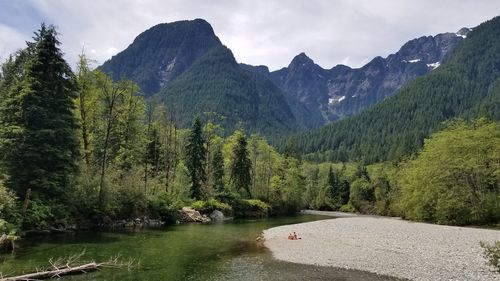 Scenic view of lake and mountains against sky