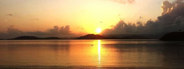 Scenic view of sunset over river