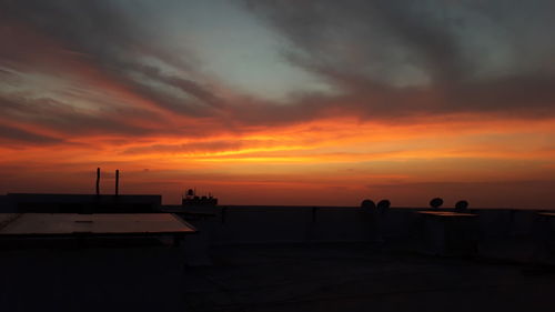 Silhouette of building during sunset