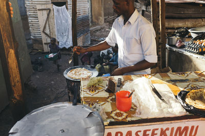 Man working on tray