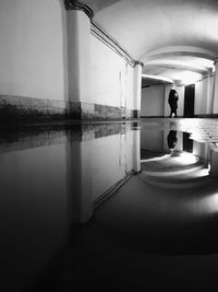 Rear view of woman standing in water