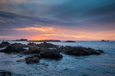 Scenic view of sea against sky during sunset