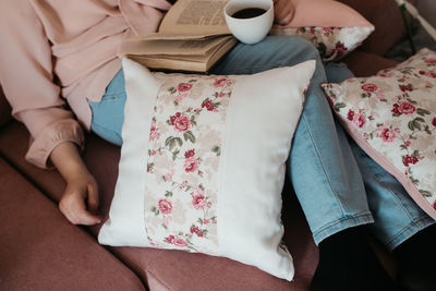 High angle view of woman reading book