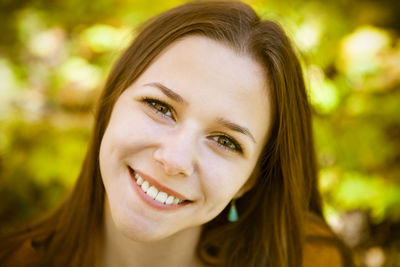 Close-up portrait of a smiling young woman