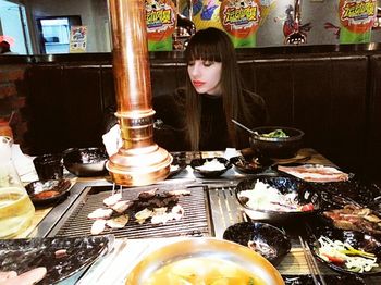 Portrait of woman sitting in restaurant