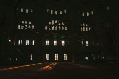 Interior of illuminated building at night