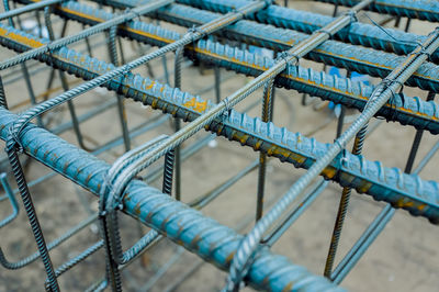 High angle view of ropes tied up on metal