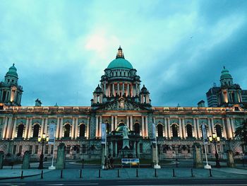 Low angle view of historical building against cloudy sky