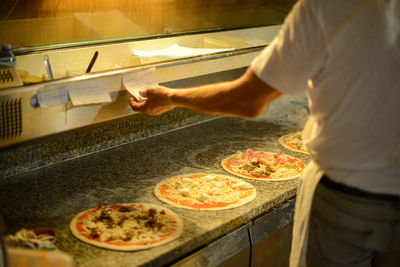 Preparing and cooking pizza in the wood copper oven