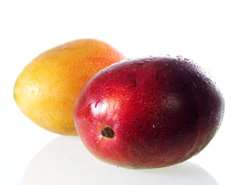 Close-up of red apple over white background