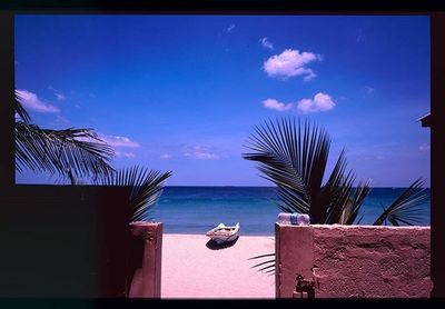 Scenic view of sea against blue sky