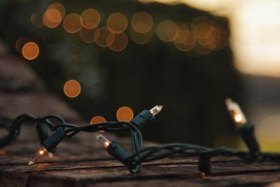 Close-up of illuminated lighting equipment on table