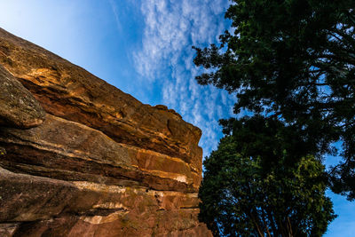 Low angle view of rock formation against sky