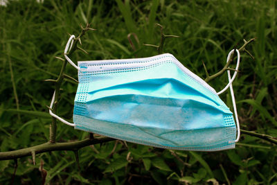 Close-up of blue umbrella on field