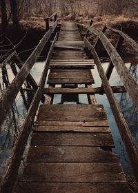 Surface level of wooden bridge in forest