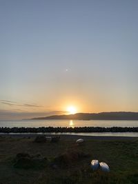 Scenic view of sea against sky during sunset
