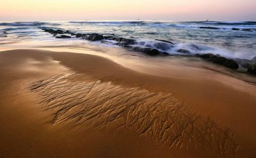 Scenic view of sea at sunset