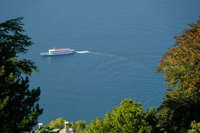 A boat on the water of lake como from a panoramic viewpoint in brunate.