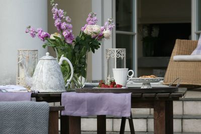 Flowers in vase on table at home