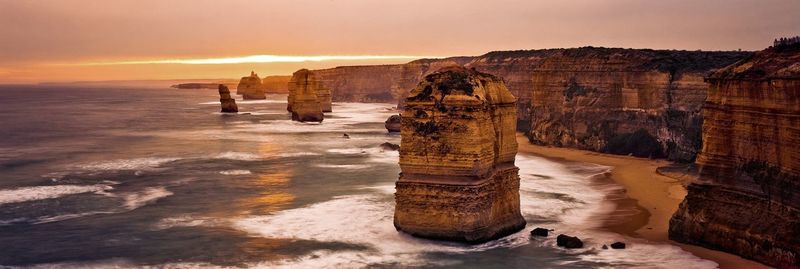 Panoramic view of sea and cliffs at port campbell national park during sunset