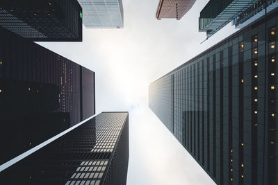 Low angle view of modern buildings against sky in city