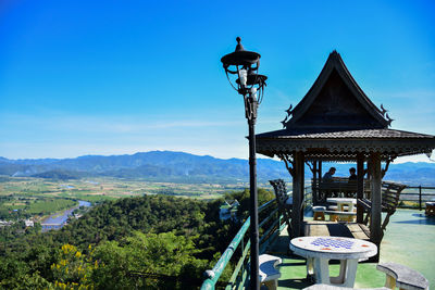 Scenic view of mountains against clear blue sky