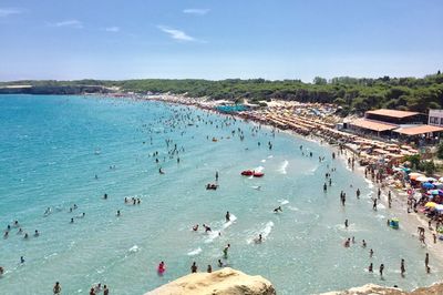 High angle view of people on beach against sky