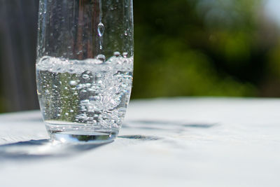 Close-up of water in glass on table