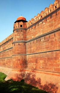 Low angle view of fort against blue sky