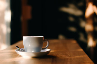 Close-up of coffee cup on table