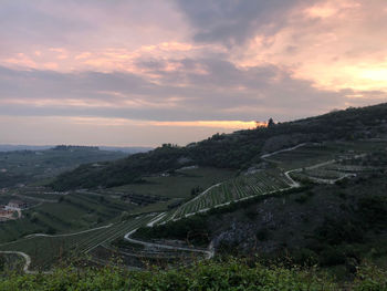 High angle view of agricultural field against sky during sunset