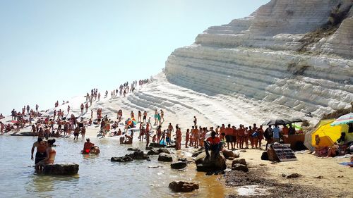 Panoramic view of people on shore