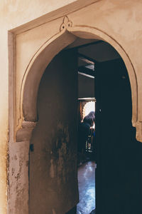 People in corridor of historic building