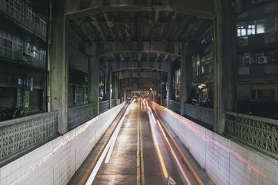Light trails on road in subway at night