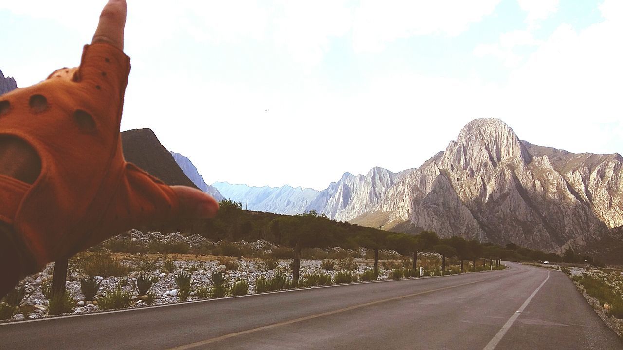 mountain, transportation, road, sky, mountain range, rock formation, landscape, the way forward, travel, nature, car, scenics, land vehicle, non-urban scene, day, tranquility, tranquil scene, rocky mountains