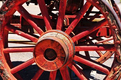 Close-up of red wheel on field