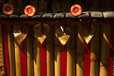 Low angle view of illuminated lanterns hanging in row