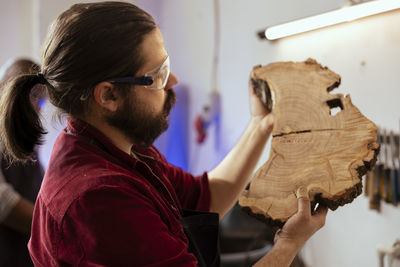 Side view of man working at home