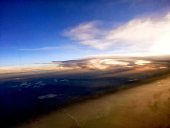 View of calm sea against cloudy sky