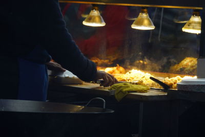 Close-up of man preparing food