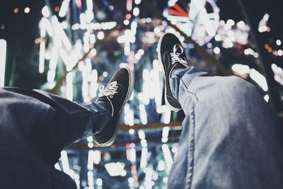 Low section of man on amusement park ride