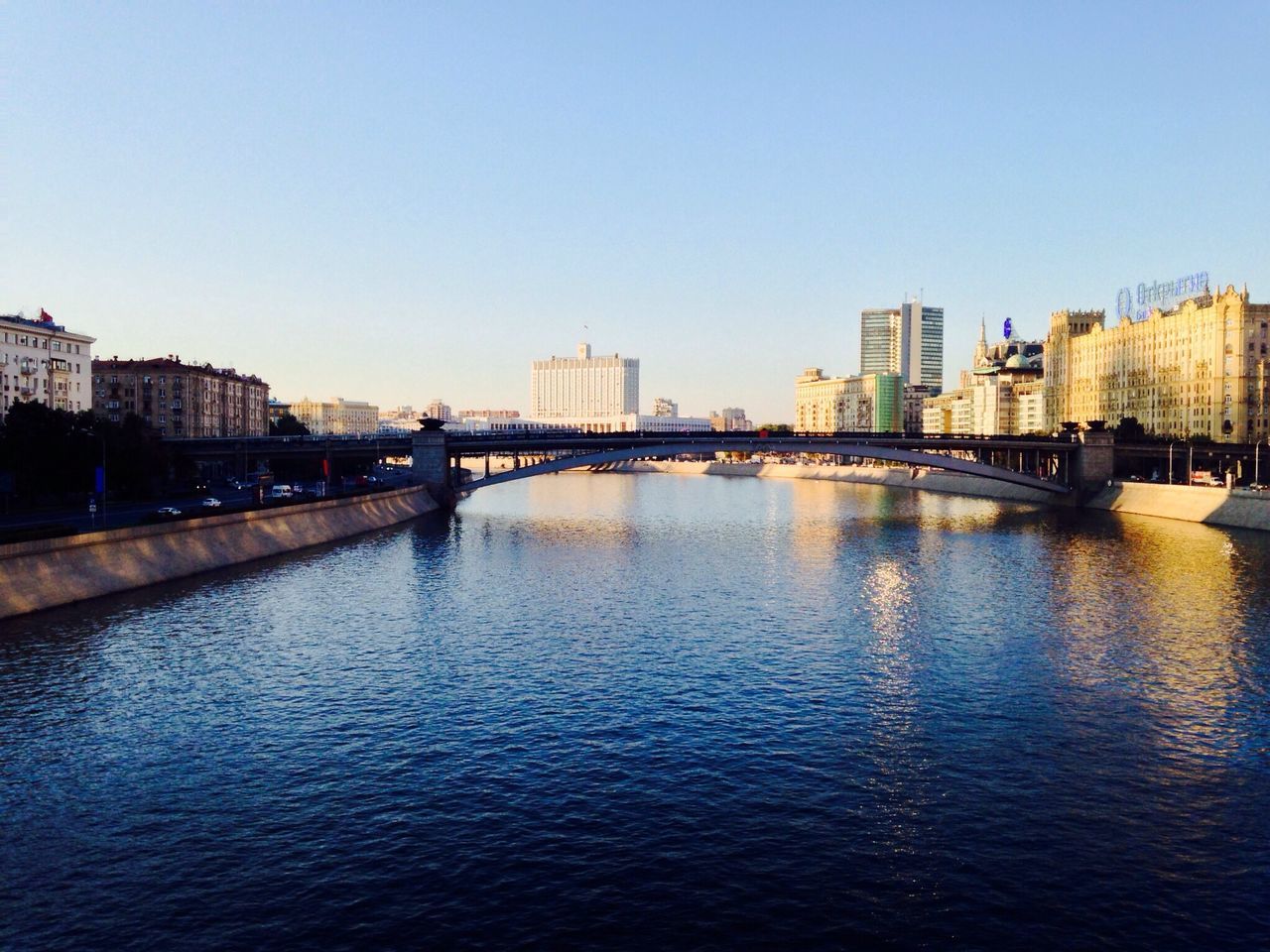 architecture, building exterior, built structure, clear sky, city, water, waterfront, river, copy space, cityscape, skyscraper, blue, urban skyline, tower, skyline, building, rippled, residential building, capital cities, city life