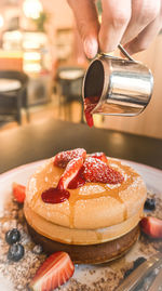 Close-up of hand holding ice cream