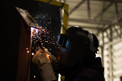 Man working on metal in workshop