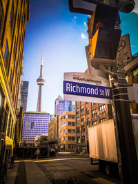 View of city street against blue sky