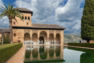 Partal palace with pool in alhambra garden, granada, spain