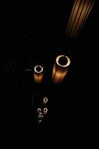 Close-up of illuminated light bulb in the dark