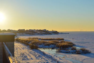 Scenic view of sea against clear sky during sunset