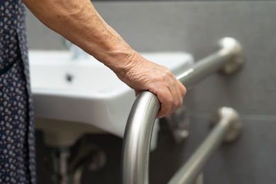 Close-up of hand holding metal