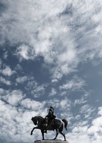 Low angle view of statue at altare della patria against sky